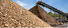 Wood chip biomass material on conveyor