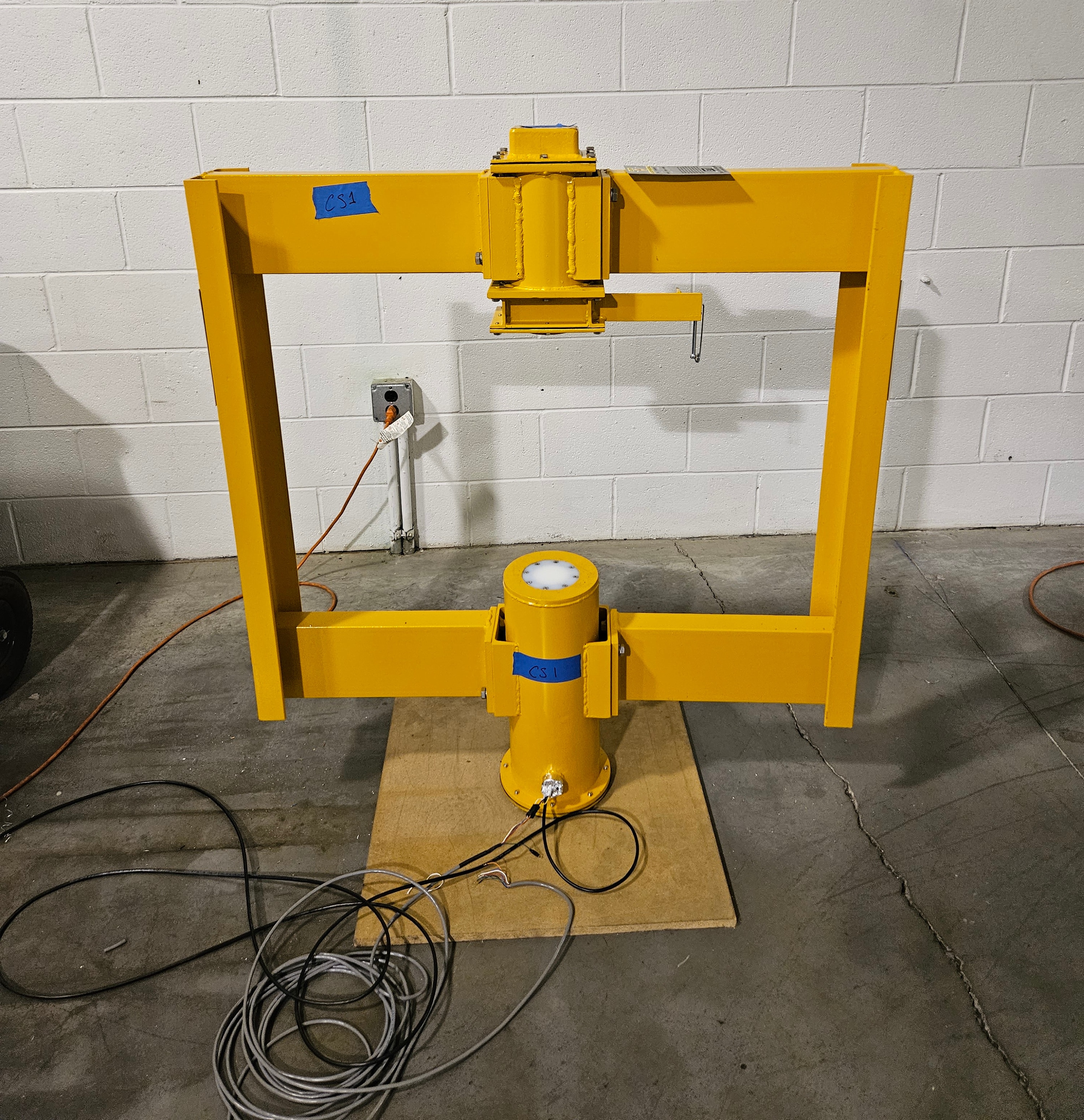 ETI integrated nuclear belt scale and analyzer frame — source holder above, detector below, mounted on conveyor frame